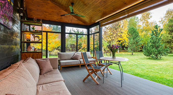 A view of the patio with various minimalistic furniture pieces, which can be used to prepare your yard for a successful home sale. 