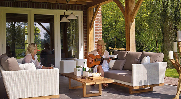 People spend time on a patio in their backyard